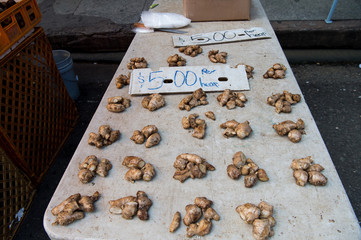Fresh ginger roots in heaps