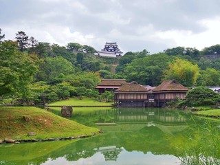 Genkyuen Garden in Hikone, Shiga Prefecture, Japan. Genkyuen Garden is a Japanese garden with a central pond and a circular walking trail. It was built on the grounds of Hikone Castle in 1677.