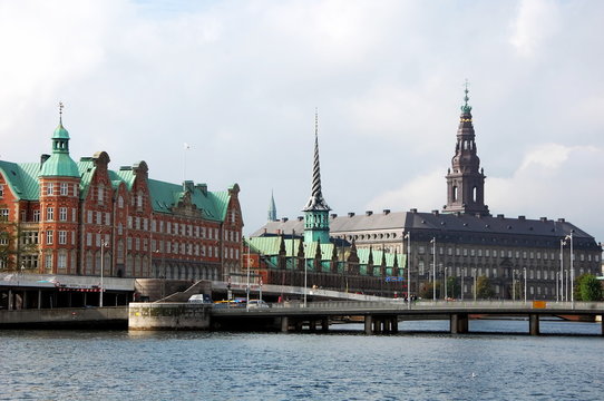 Panoramic view on Christiansborg Palace and Stock Exchange over the channel in Copenhagen, Denmark