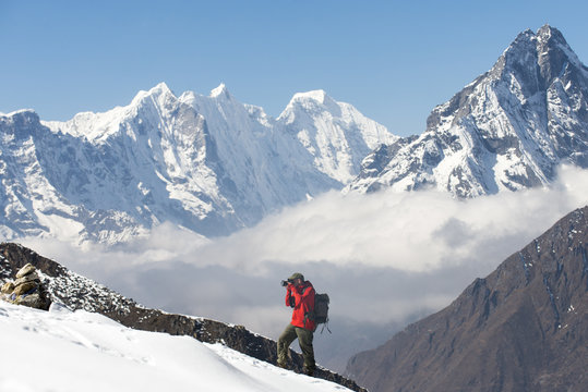 A photographer working in the Everest region of the Nepal Himalayas, Khumbu Region, Nepal