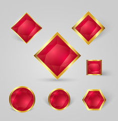 collection of shiny gold badges with red crystals and shadows