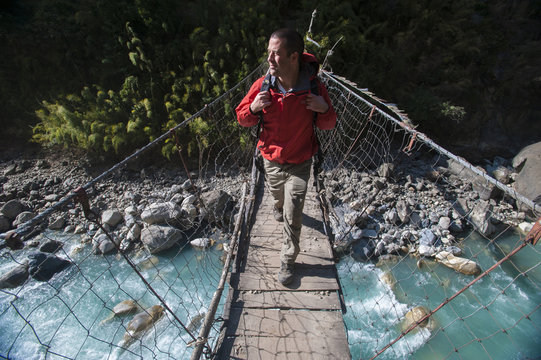 A wire suspension bridge across the Gandaki River, Manaslu Region, Nepal