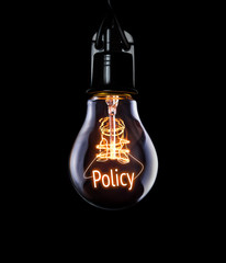 Hanging lightbulb with glowing Policy concept.