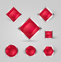 collection of shiny silver badges with red crystals and shadows