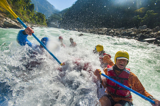 Rafters get splashed as they go through some big rapids on the Karnali River, west Nepal