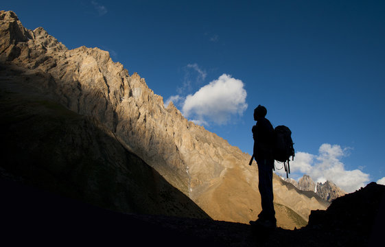 A trekker takes in the dramatic scenery from near the top of the Dung Dung La at 4710m during the Hidden valleys trek, Ladakh