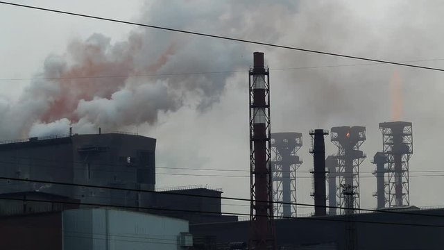 Emissions from the chimneys of the plant, flames and toxic fumes pollutes the environment, 4k

