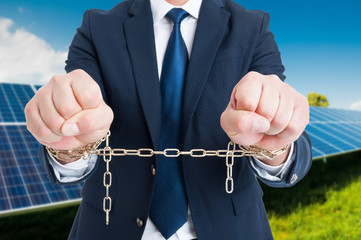 Closeup of chained businessman hands