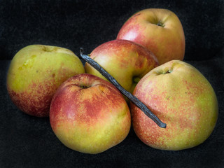 Fresh apples and a vanilla pod