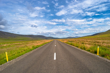 Isolated road and Icelandic landscape at Iceland, summer