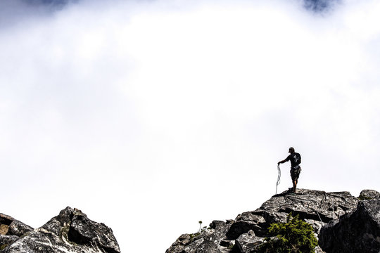 Abseiling off of a cliff edge and into the clouds, Cape Town, South Africa