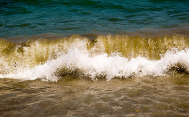 Windy sea creates crushing and strong waves, which in a seconds blue sea turns into frenzied flood that destroys everything in its way. 