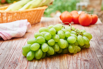 Grapes on wooden table