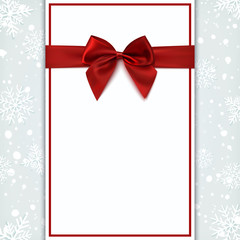 Blank greeting card with red bow.