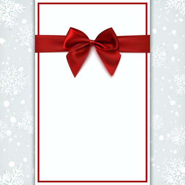 Blank greeting card with red bow.