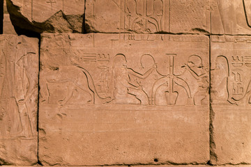 LUXOR, EGYPT: Ancient ruins of Karnak temple in Egypt at noon. The complex is a vast open-air museum, and the second largest ancient religious site in the world