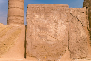 LUXOR, EGYPT: Ancient ruins of Karnak temple in Egypt at noon. The complex is a vast open-air museum, and the second largest ancient religious site in the world