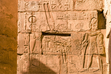LUXOR, EGYPT: Ancient ruins of Karnak temple in Egypt at noon. The complex is a vast open-air...