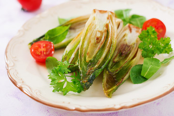 Baked chicory with onions and herbs.