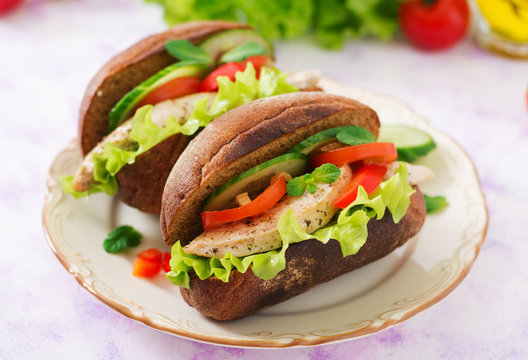 Two delicious and healthy sandwich hot dog with chicken and vegetables.