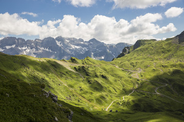 Fototapeta premium Bucolic green summer alpine landscape, Swiss Alps mountain massif, canton du Valais, Switzerland