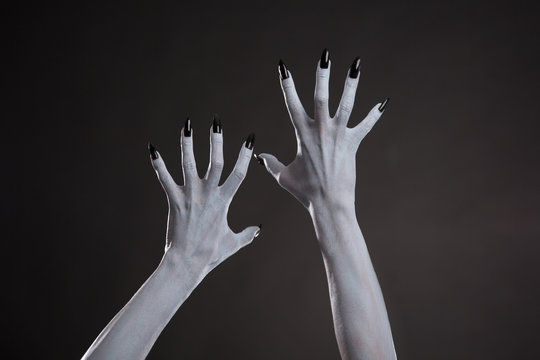 Demonic hands with black nails