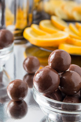 Chocolate candies in a small glass bowl close-up with blur