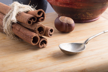 Bunch of cinnamon sticks and vintage silver spoon