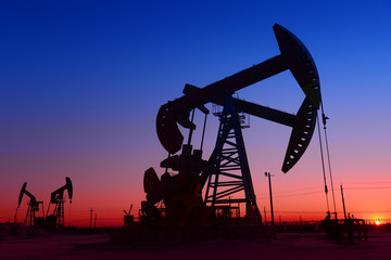The beam pumping unit is homework, sunset in oil field