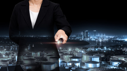 Double exposure of business with night refinery blurred backgrou © PPstock
