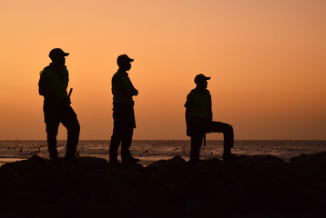Policemen silhouette during sunset in Cartagena