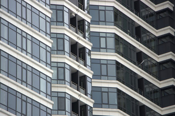 Texture of multistory building wall with windows