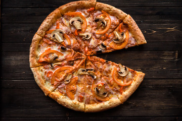 Italian pizza on wooden table