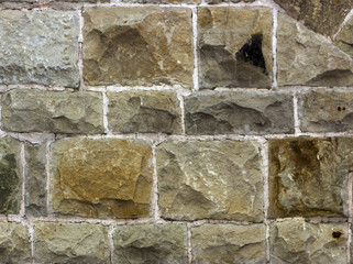 ancient wall of sandstone blocks, stone