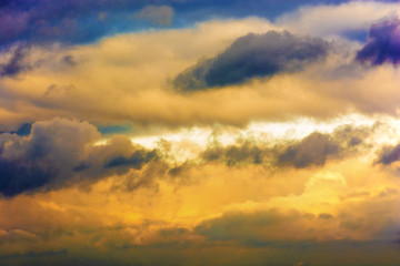 Dark storm clouds in the sky. Blurring background. Bright colors.