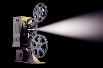 Retro film projector with light beam on black