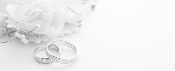 Wedding rings on wedding card on a white background, border design panoramic banner - 129676401