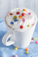 coffee with whipped cream and colorful chocolate drops