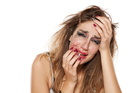 Crying Young Woman With Messy Hair Smeared Makeup