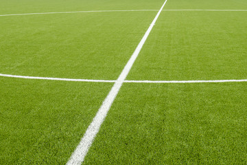 The white Line marking on the artificial green grass soccer field