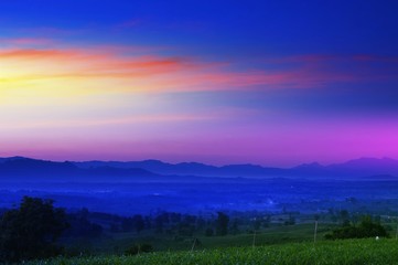 Sunset with silhouetted mountains at Moon, Colorful Style