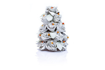 Christmas tree made from book pages isolated on white background