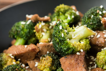 Fried broccoli and beef in pan