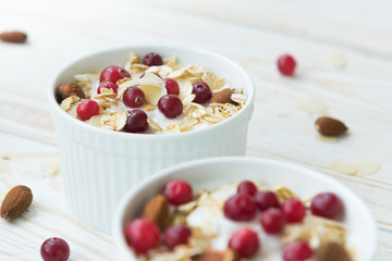 Yogurt with cranberries, almonds, oatmeal, almond flakes