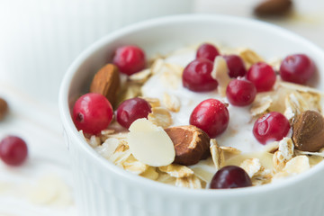 Fresh homemade yogurt with almond flakes