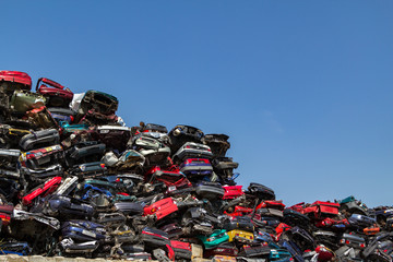 Stacked cars at a junkyard in Amsterdam - obrazy, fototapety, plakaty