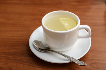 Tea with a lemon in a cup