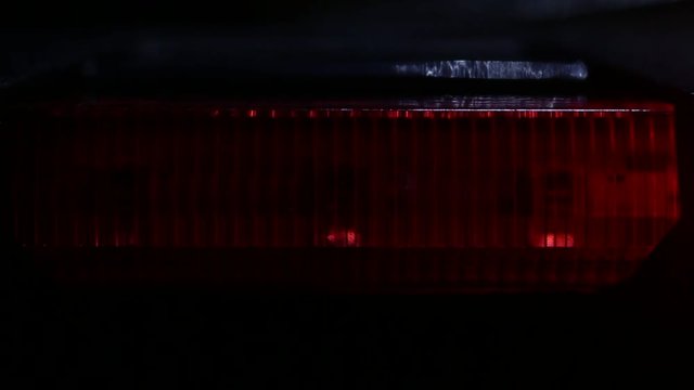 LED lights are shining through red glass