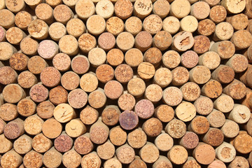 Background of used wine corks. Wall of many different wine corks. Closeup of wine corks.
