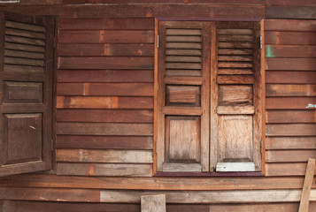 Obraz na płótnie Canvas Wooden window and plank wall background